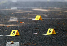 Yellow evidence markers labeled 8, 9, 10 on pavement.