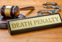 Thin Evidence, No Execution Gavel handcuffs and death penalty sign on table