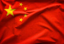 Red flag with five yellow stars, Chinas flag.