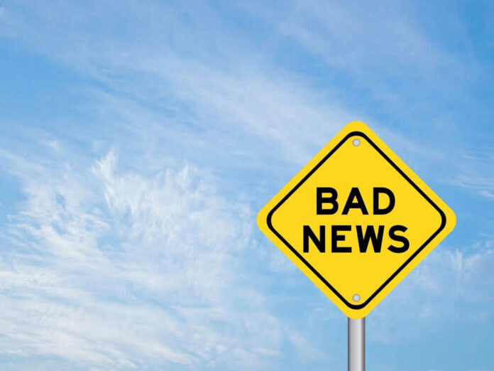 Yellow sign reads bad news in sky