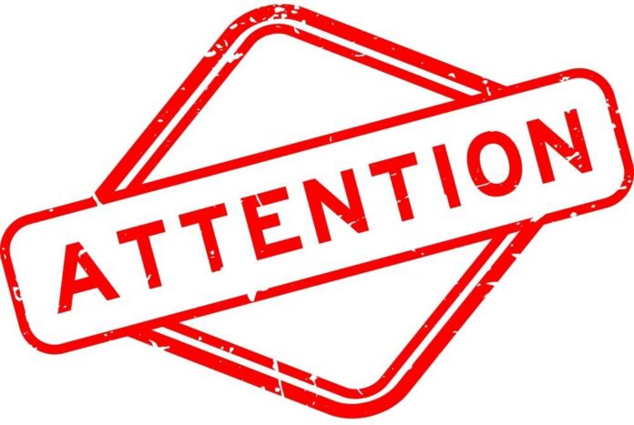 Red attention sign with the word 'ATTENTION' in bold letters