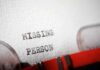 Close-up of a typewritten document with the words 'MISSING PERSON'