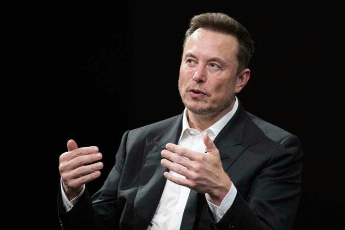 shutterstock_2318800325 Elon Musk speaking and gesturing with hands in discussion.