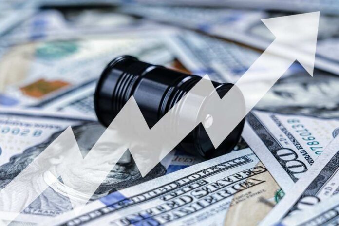 An oil barrel placed on a background of dollar bills with an upward trend graph overlay