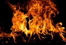 Bright flames dancing against a dark background