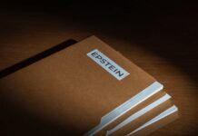 Stack of brown file folders with a label reading 'EPSTEIN'