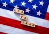 Wood letter blocks on an American flag