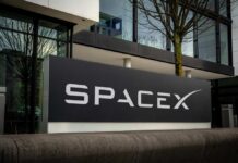 SpaceX sign outside a modern office building