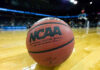 Close-up of NCAA basketball on court.