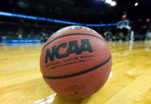 Close-up of NCAA basketball on court.