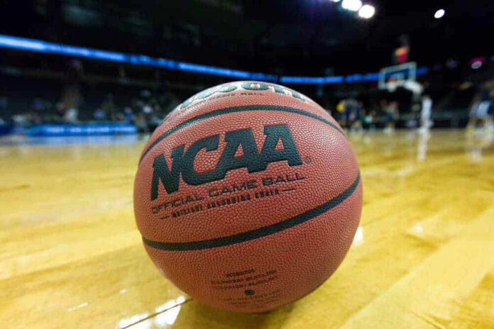 Close-up of NCAA basketball on court.