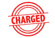 Red charged stamp with circular border